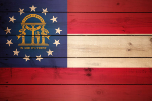 Georgia state flag painted on rustic wooden planks